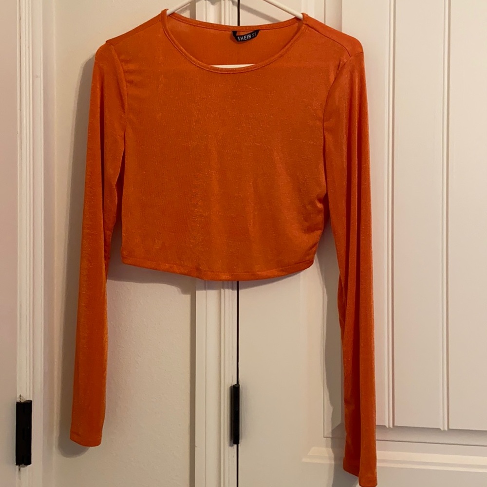 An orange crop top